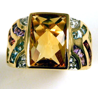 Appraisal: CITRINE AND FOURTEEN KARAT GOLD RING centering a checkerboard-cut citrine