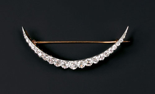 Appraisal: K yellow gold and platinum diamond crescent brooch containing nineteen