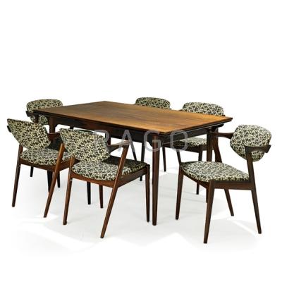 Appraisal: KAI KRISTIANSEN b Draw-leaf dining table and eight chairs Denmark