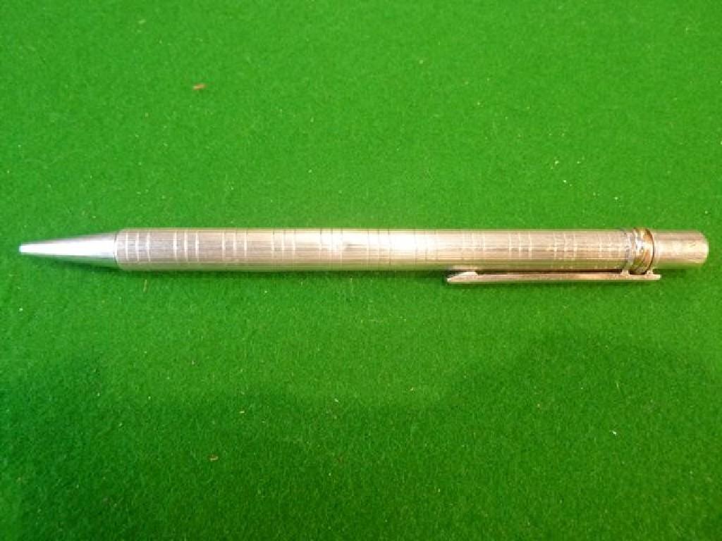 Appraisal: A Cartier pen with engine turned detail and entwined gold