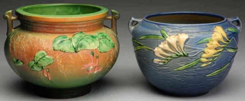 Appraisal: Pair of Roseville Jardinieres Includes one green fuchsia jardiniere and