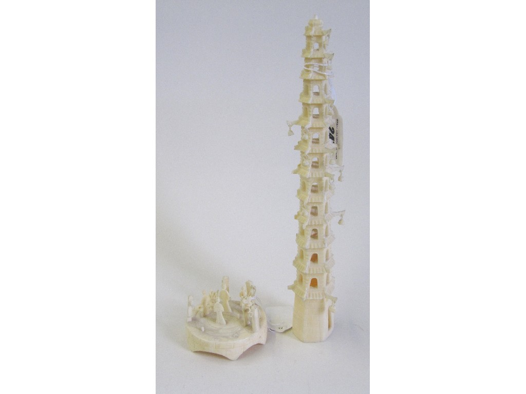 Appraisal: carved ivory model of a tower with figures two parts