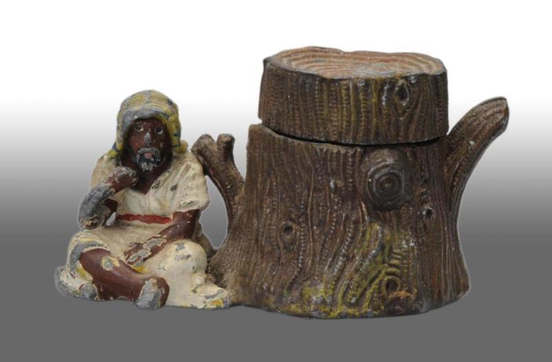 Appraisal: Arab Sitting by Tree Stump Inkwell Description Lead metal Open