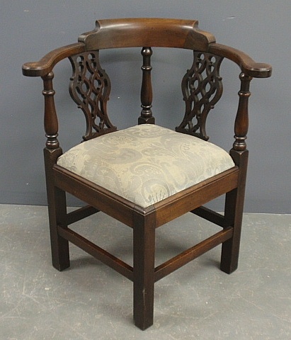 Appraisal: - Chippendale style mahogany corner chair with carved pierced splats