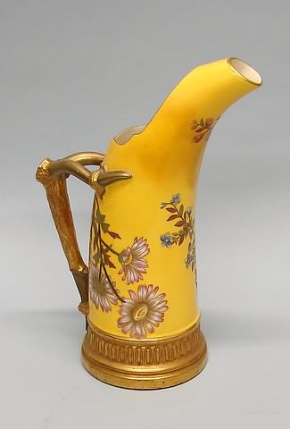 Appraisal: Reg No bold lavender flowers on yellow ground staghorn-form handle