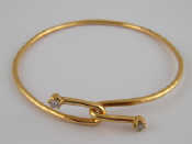 Appraisal: A yellow metal tests carat gold diamond set bangle