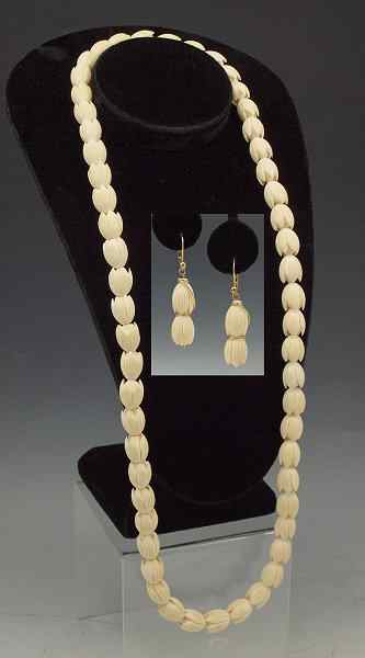 Appraisal: CARVED IVORY BEAD NECKLACE AND EARRINGS Blossom motif beads one