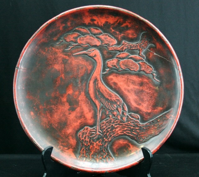 Appraisal: An early th century Chinese red lacquer plate decorated with