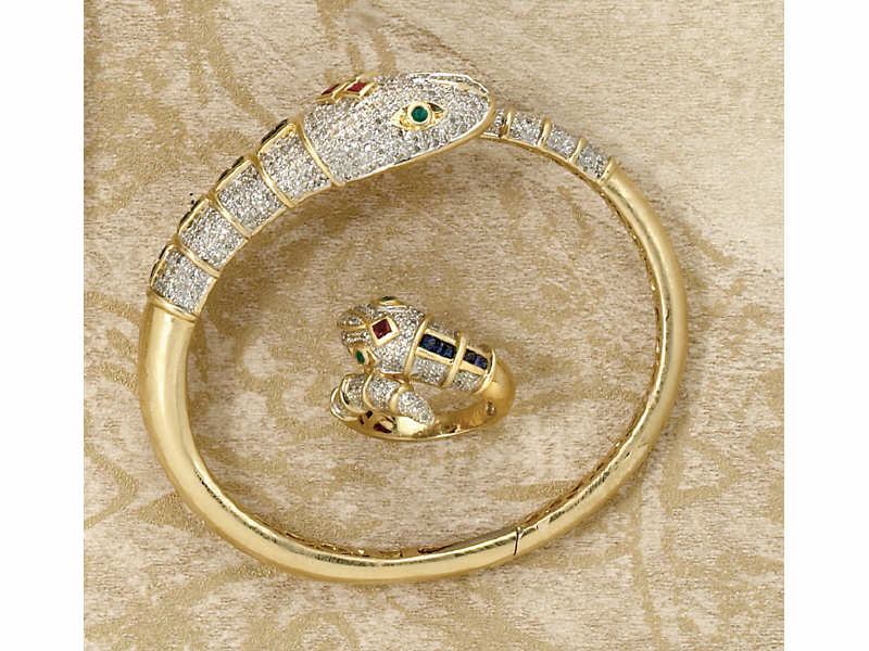 Appraisal: SNAKE DESIGN SUITE k yellow gold bangle bracelet and ring