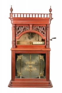 Appraisal: Upright Regina Changer Music Box Carved mahogany case Contains original