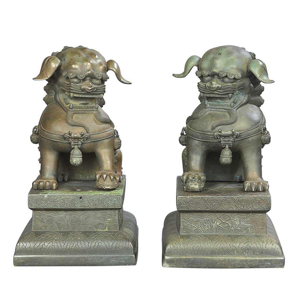 Appraisal: Pair of Chinese Bronze Foo Lions Qing Dynasty The seated