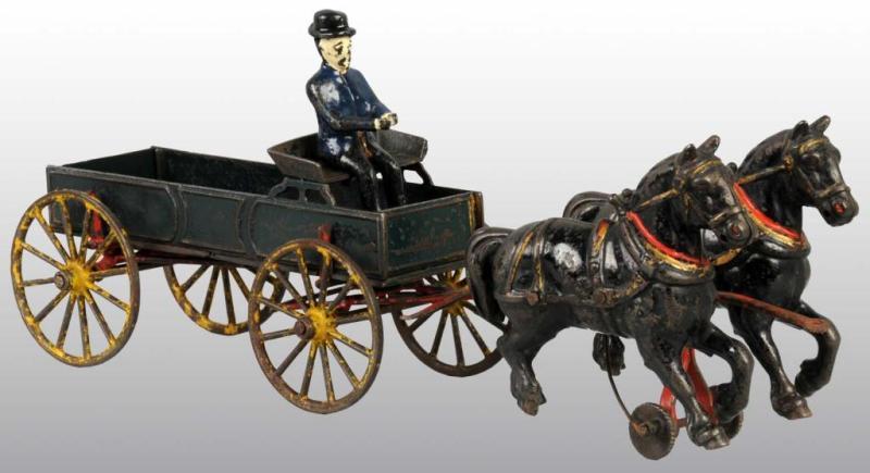 Appraisal: Cast Iron Wilkins Farm Wagon Toy Description Pulled by two