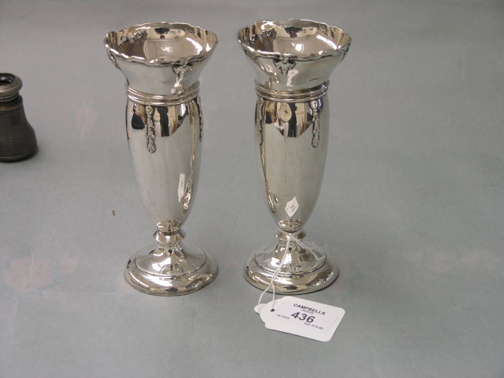 Appraisal: A pair of silver vases with husk detail Birmingham in