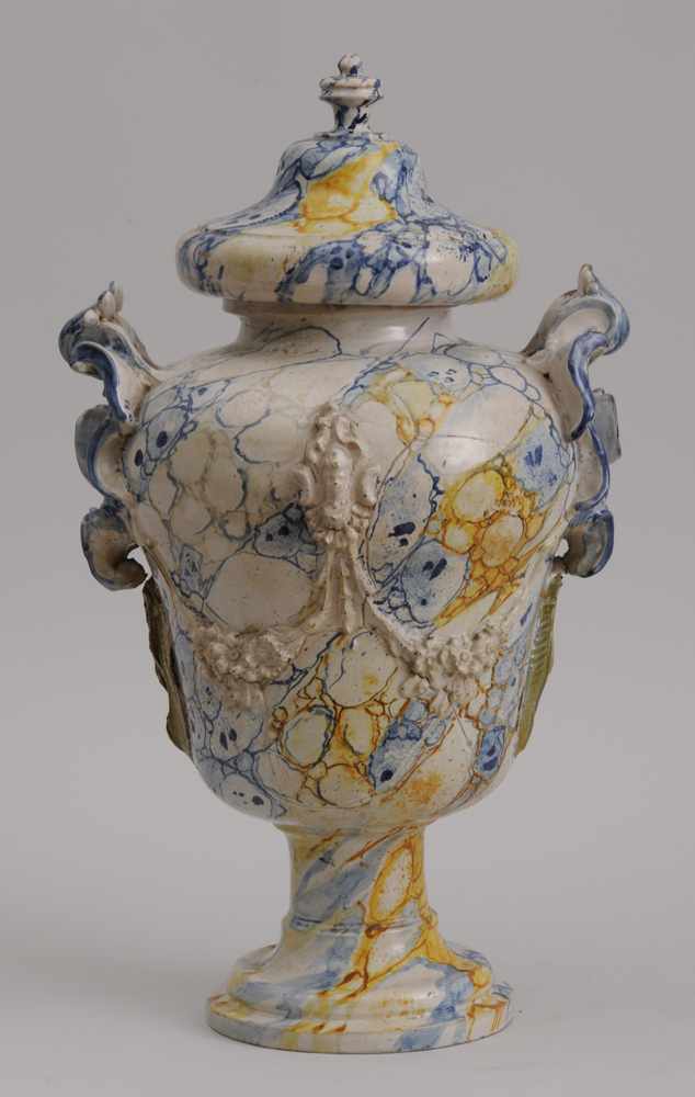 Appraisal: ITALIAN ROCOCO STYLE TIN AND MARBELIZED GLAZED EARTHENWARE URN AND