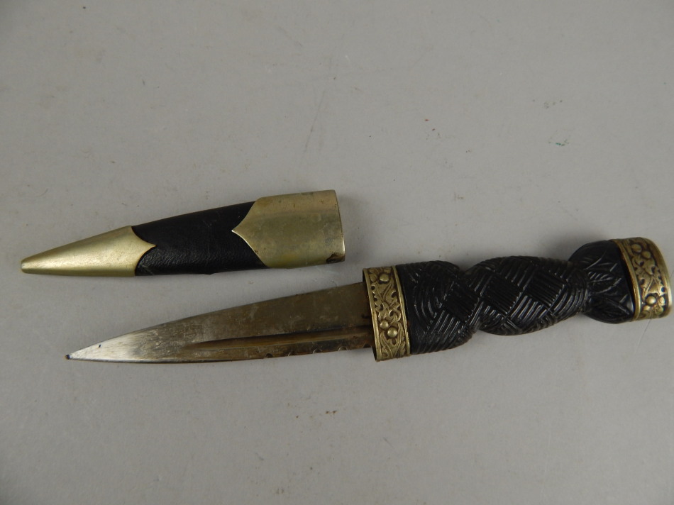 Appraisal: A Scottish small dagger with stylised basket work handle plated