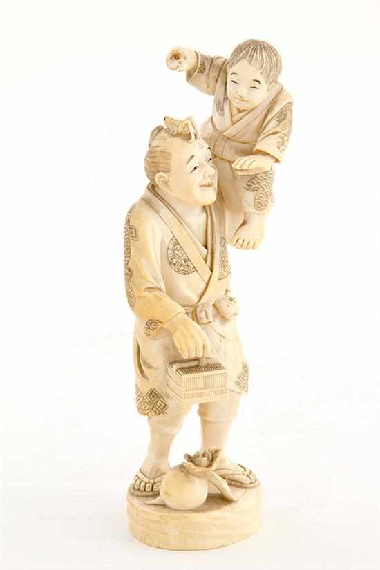 Appraisal: Japanese carved ivory okimono th century young boy held by