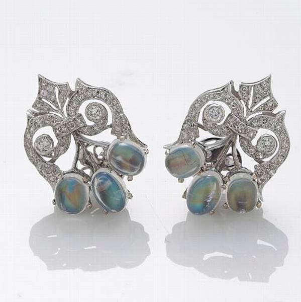 Appraisal: A pair of moonstone diamond and k white gold earrings