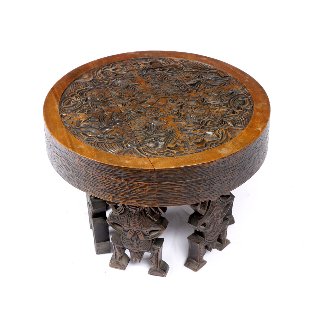 Appraisal: CARVED AFRICAN ROUND LOW TABLE Heavily carved African low table