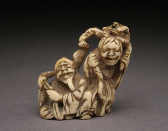 Appraisal: ANTIQUE IVORY NETSUKE Antique carved ivory netsuke of two ascetics