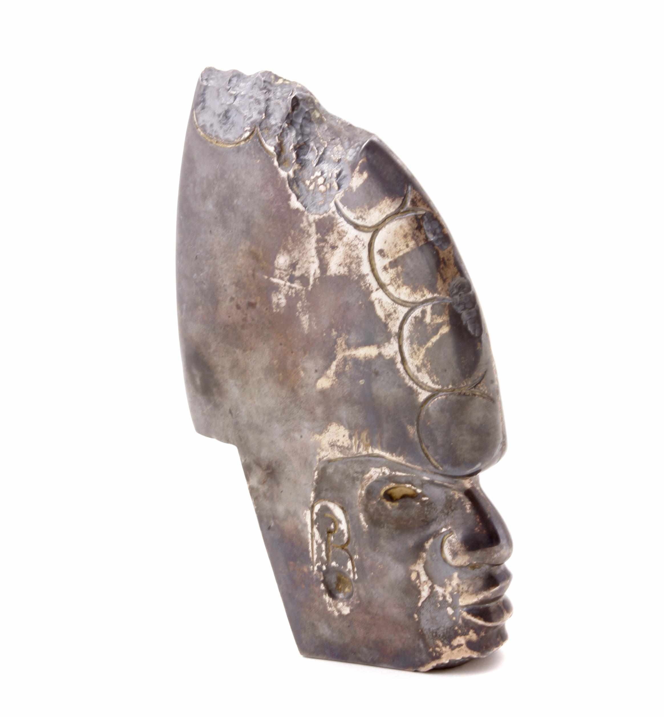 Appraisal: A Mexican sterling silver 'Aztec' head sculpture Salvador de la