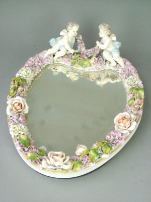 Appraisal: Continental porcelain flower encrusted heart shaped mirror painted in coloured