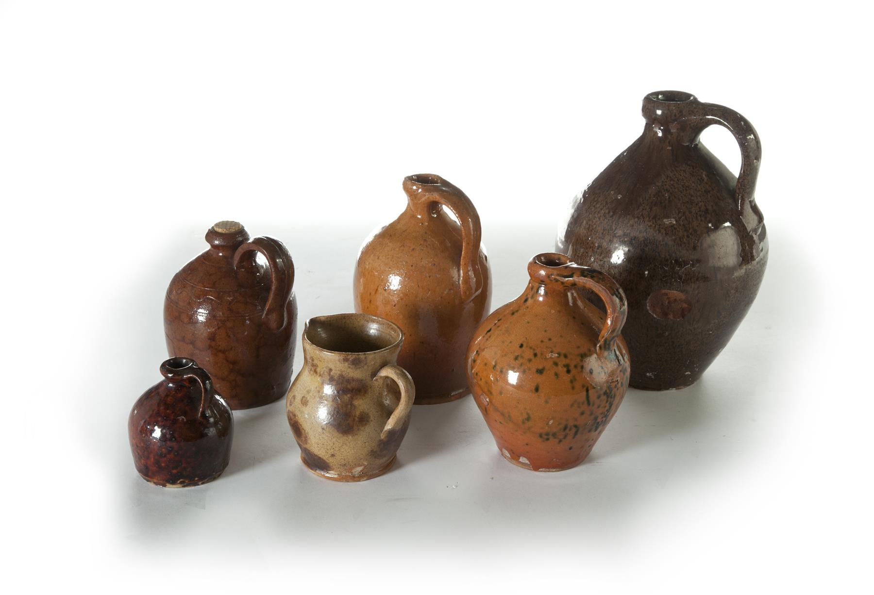 Appraisal: SIX HANDLED PIECES OF REDWARE Mid th century All with