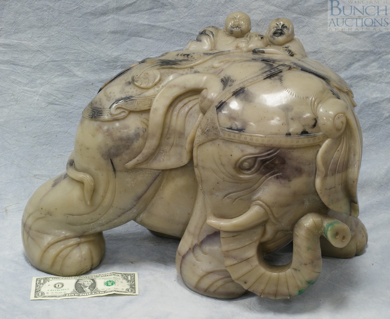 Appraisal: Carved jade elephant with boys riding h l w