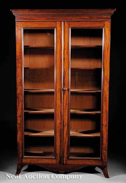 Appraisal: An Antique Georgian-Style Mahogany Bookcase c molded cornice glazed doors