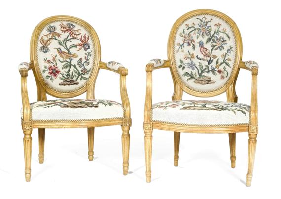 Appraisal: A PAIR OF MEDALLION-BACK ARMCHAIRS Louis XVI France Molded and