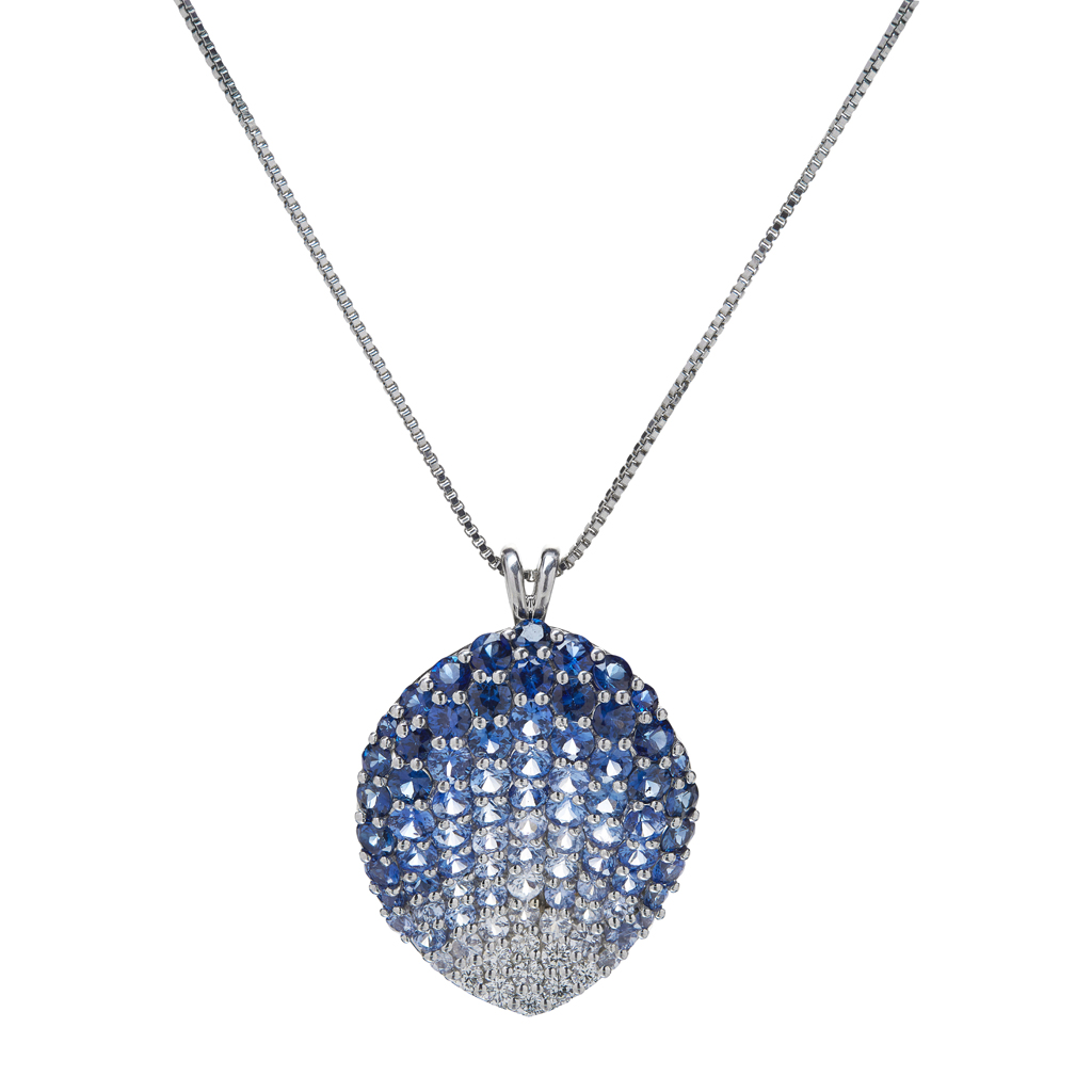 Appraisal: A contemporary sapphire set pendant of curved drop shape pave