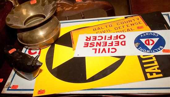 Appraisal: Four metal civil defense signs and contemporary figure of a