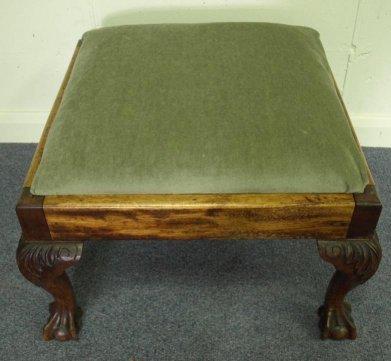 Appraisal: A mahogany stool with loose trap seat on carved cabriole