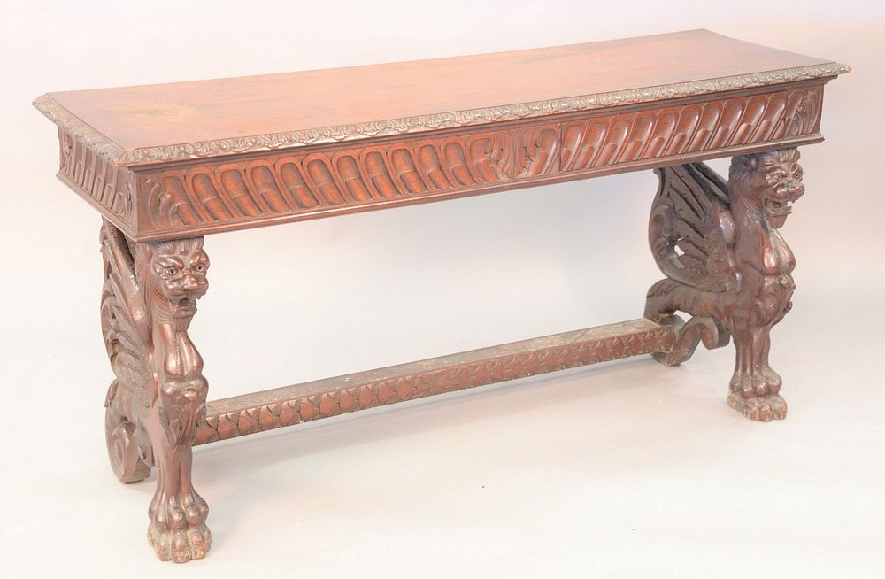 Appraisal: Walnut hall table with winged griffin supports and one drawer