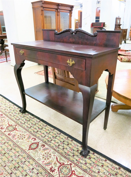 Appraisal: A MAHOGANY SERVING STAND Chippendale Revival style American c a