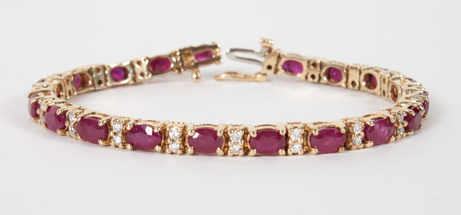 Appraisal: Lady's K gold ruby diamond tennis bracelet in L grams