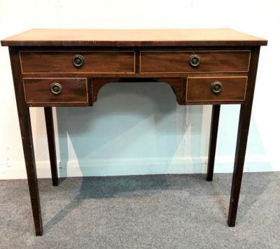 Appraisal: A George III mahogany kneehole dressing table fitted an arrangement