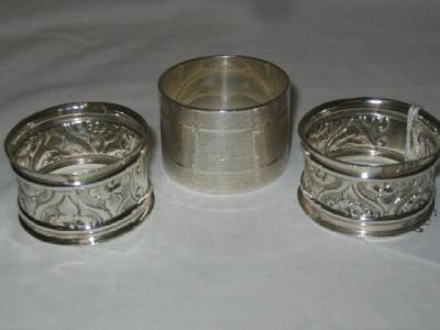 Appraisal: A NAPKIN RING with engine turned banding wide Birmingham and