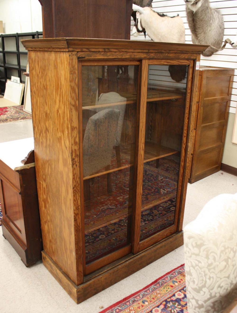 Appraisal: FIR WOOD CABINET BOOKCASE American c having three adjustable pine