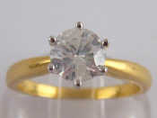 Appraisal: A yellow metal tests carat gold round brilliant cut diamond