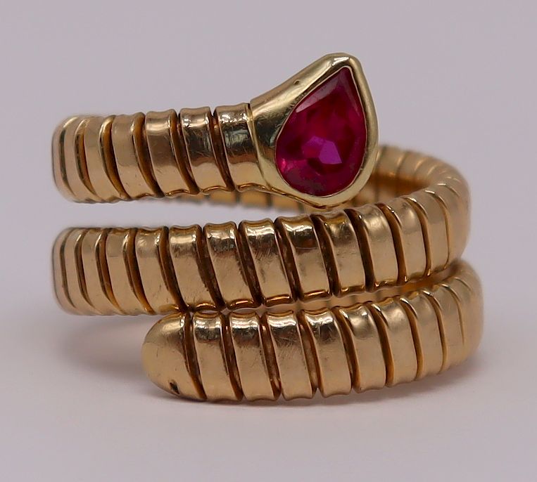 Appraisal: JEWELRY Bvlgari Style kt Gold Ruby Coil Ring Includes an