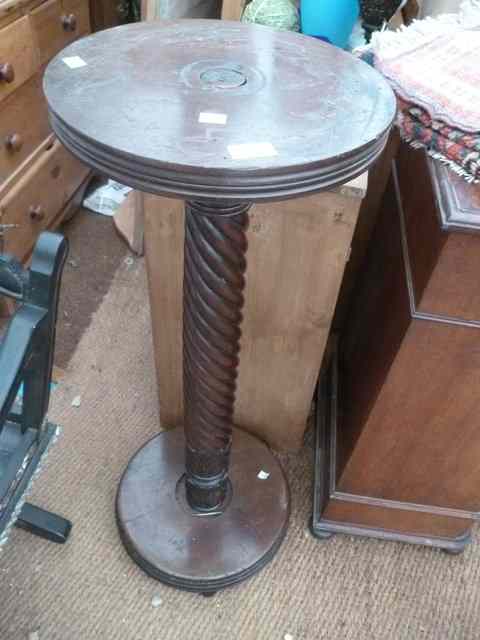 Appraisal: A MAHOGANY TORCHERE with spiral column support wide