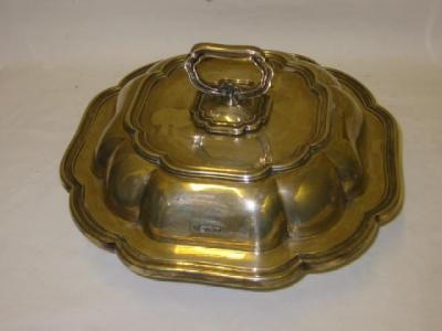 Appraisal: AN ENTREE DISH of lobed square form with moulded loop