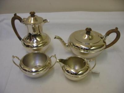 Appraisal: A FOUR PIECE TEA SET of circular form the domed