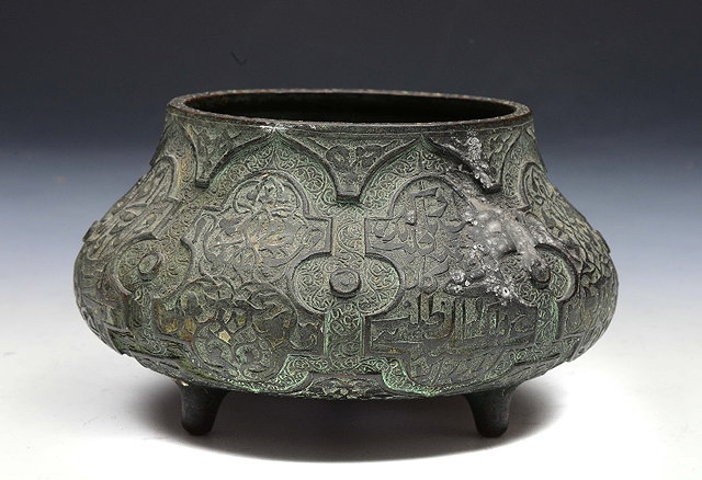 Appraisal: A MIDDLE EASTERN PROBABLY PERSIAN BRONZE OBLATE BOWL with foliate