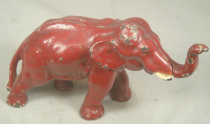 Appraisal: Cast iron doorstop free standing red elephant chipping throughout tall