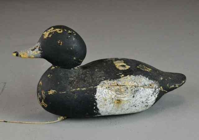 Appraisal: WOODEN DUCK DECOYCarved wooden painted duck decoy black with white