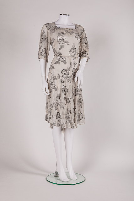 Appraisal: A s light grey chiffon dress with embroidered black flower