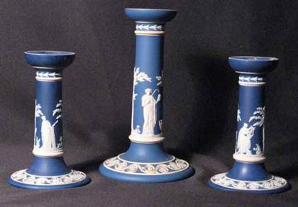 Appraisal: Three piece Wedgwood blue jasperware candlesticks H of pair in