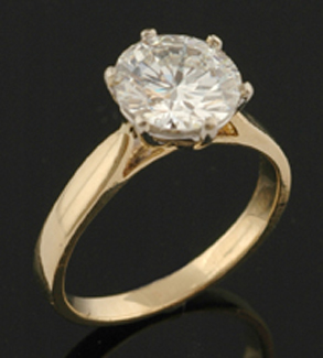 Appraisal: A solitaire diamond ring The round brilliant cut diamond weighing