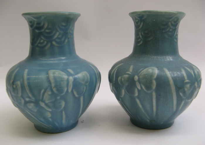 Appraisal: PAIR AMERICAN ROOKWOOD POTTERY VASES matte blue with raised butterflies